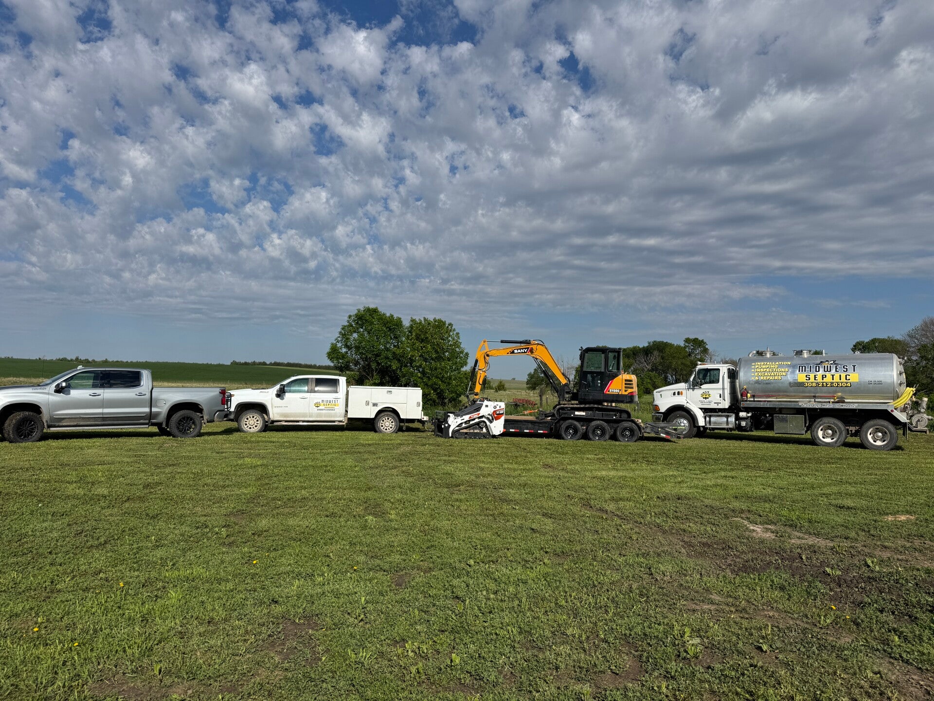 Midwest Septic equipment working on a rural property