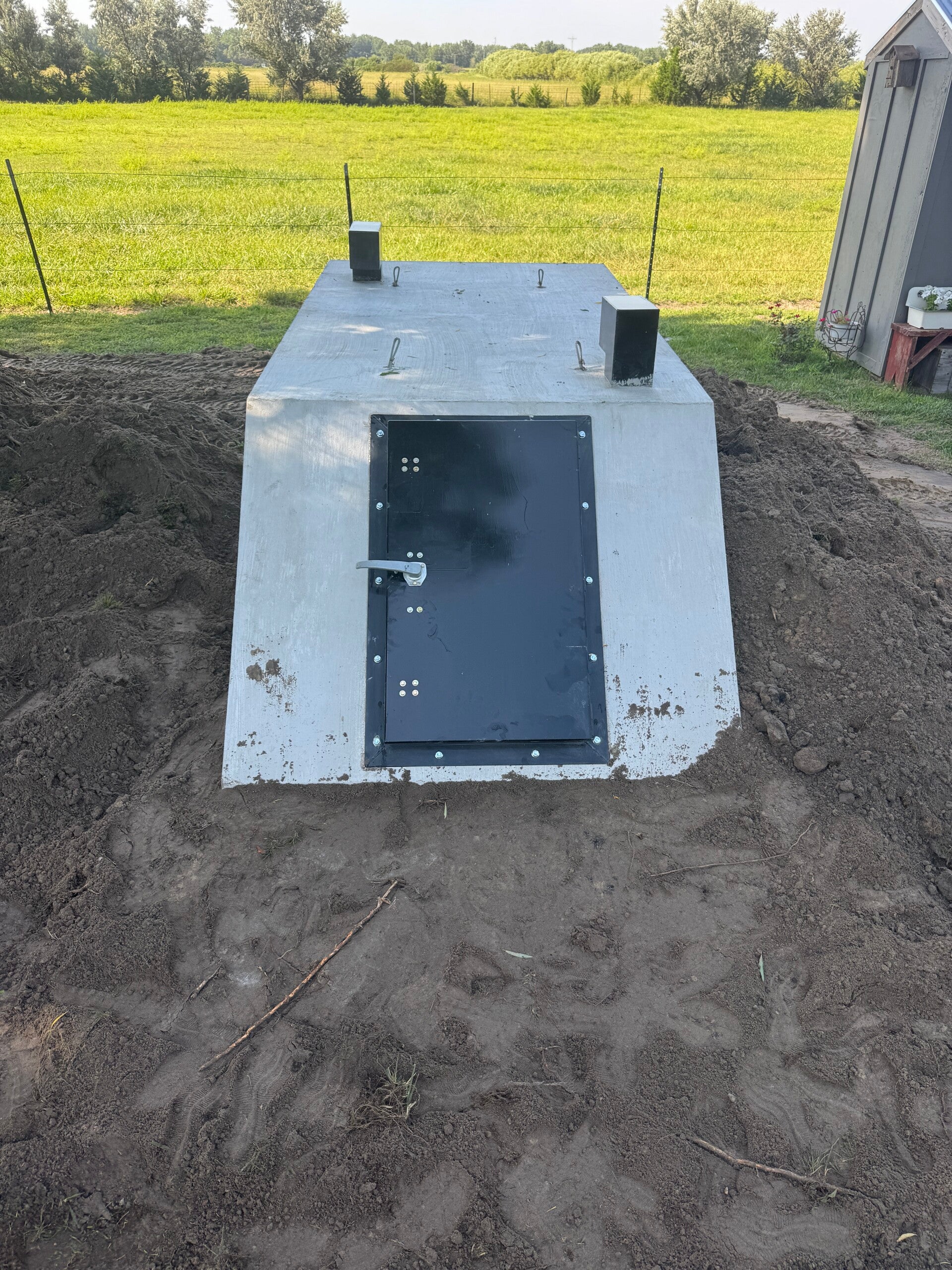 Installed underground storm shelter